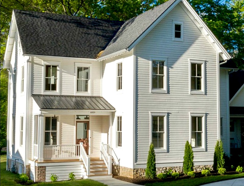 White farmhouse before