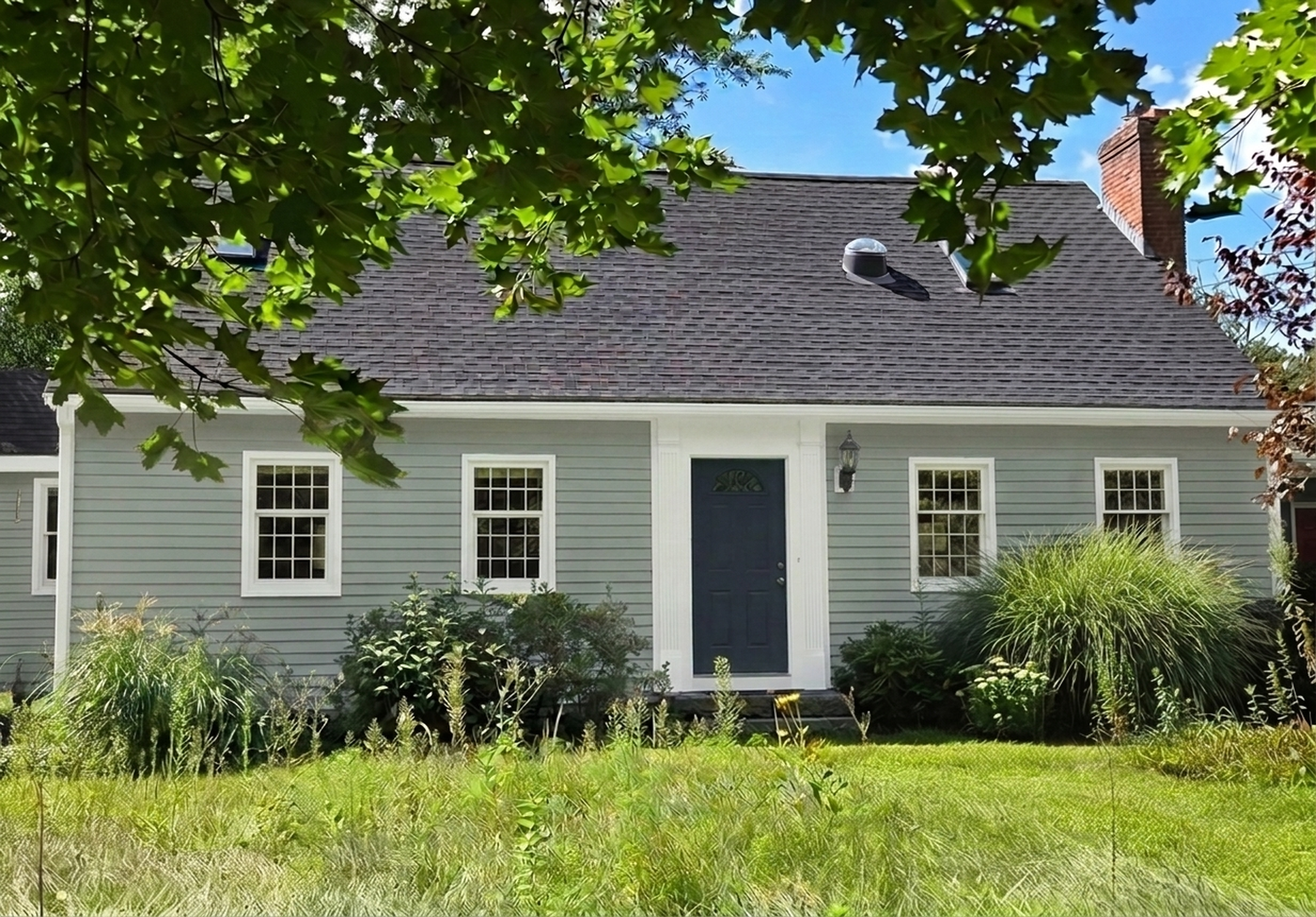 A home repainted in Quietude and Pure White